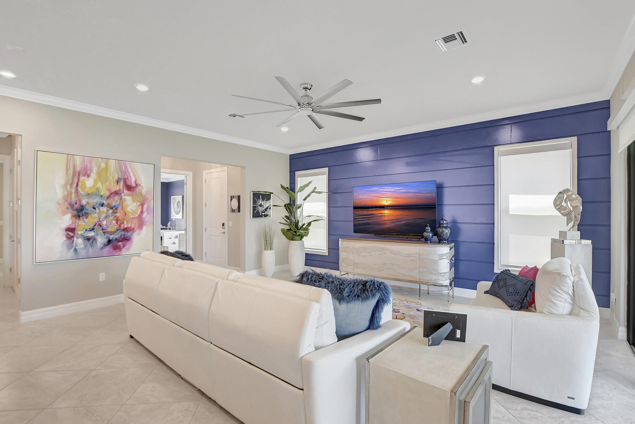 21876 Canadensis Circle, Unit 101 Boca Raton, FL 33428 - Photo 8 of 45 a living room with furniture and a flat screen tv