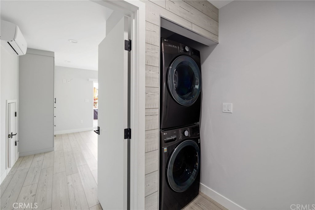5 Clipper Road, Unit A Rancho Palos Verdes, CA 90275 - Photo 13 of 20 a view of a hallway with washer and dryer
