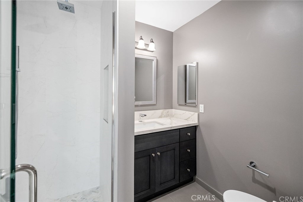 5 Clipper Road, Unit A Rancho Palos Verdes, CA 90275 - Photo 18 of 20 a bathroom with a granite countertop sink and a mirror