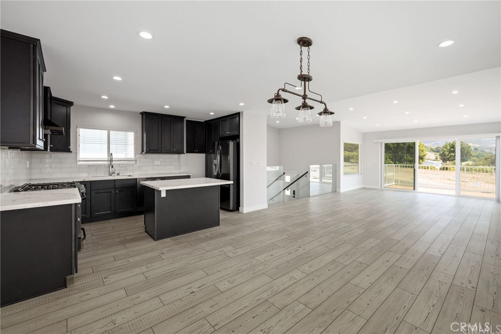 5 Clipper Road, Unit A Rancho Palos Verdes, CA 90275 - Photo 5 of 20 a large kitchen with stainless steel appliances granite countertop a lot of counter space and wooden floors