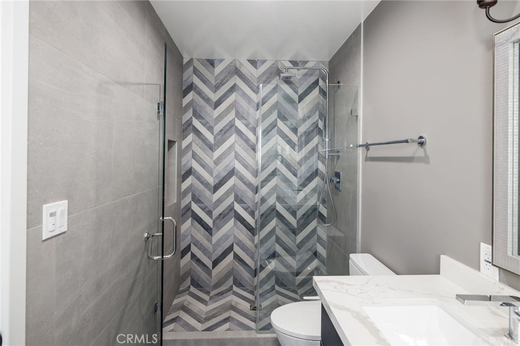 5 Clipper Road, Unit A Rancho Palos Verdes, CA 90275 - Photo 10 of 20 a bathroom with a sink a toilet and shower curtain