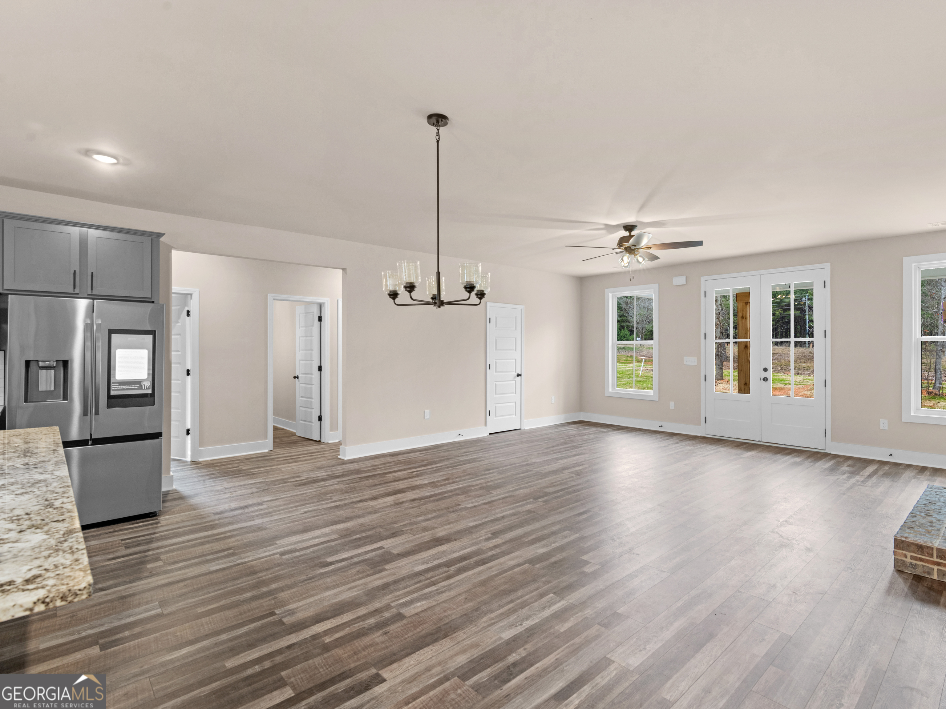 160 Loyd Road Mansfield, GA 30056 - Photo 21 of 53 a view of an empty room with window and wooden floor