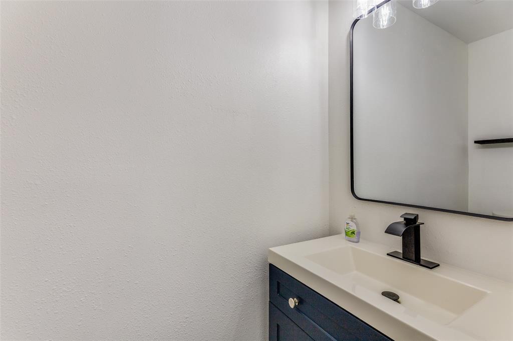 6617 Starnes Road Watauga, TX 76148 - Photo 18 of 22 a bathroom with a sink and a vanity