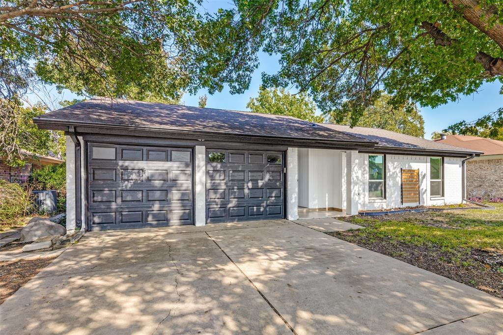 6617 Starnes Road Watauga, TX 76148 - Photo 2 of 22 a front view of a house with a garden