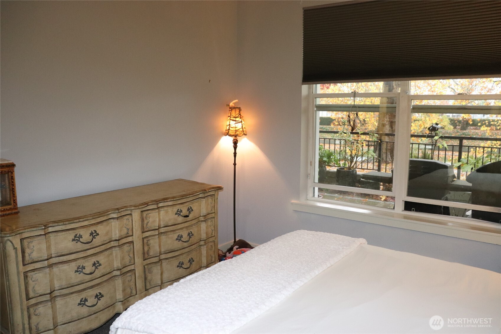 55 Williams Avenue South, Unit 104 Renton, WA 98057 - Photo 15 of 22 a bedroom with a bed and large windows