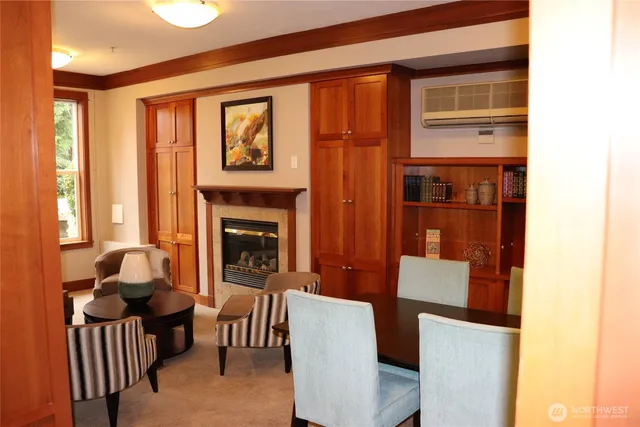 a living room with furniture a window and a fireplace