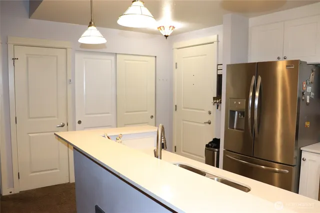 a bathroom with a sink and a large mirror
