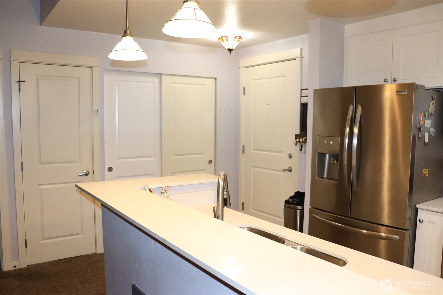 55 Williams Avenue South, Unit 104 Renton, WA 98057 - Photo 4 of 22 a bathroom with a sink and a large mirror