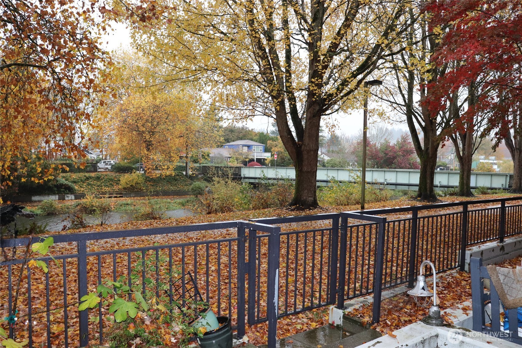 55 Williams Avenue South, Unit 104 Renton, WA 98057 - Photo 8 of 22 a view of a street next to a yard and fountain