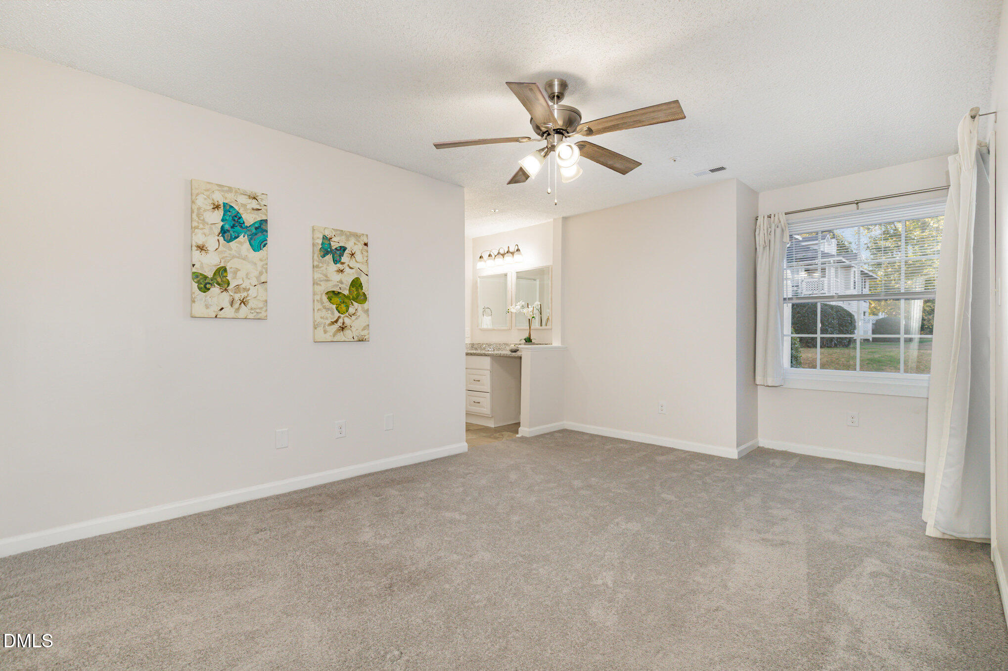 4911 Hollenden Drive, Unit 108 Raleigh, NC 27616 - Photo 10 of 19 a view of an empty room with a window