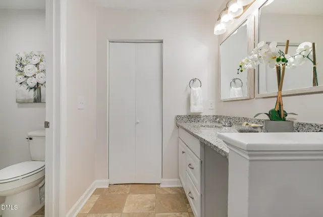 a kitchen with stainless steel appliances kitchen island granite countertop a refrigerator and microwave