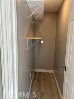 595 North Fillmore Place, Unit B1 Pomona, CA 91768 - Photo 4 of 4 a view of a room with racks on the wall