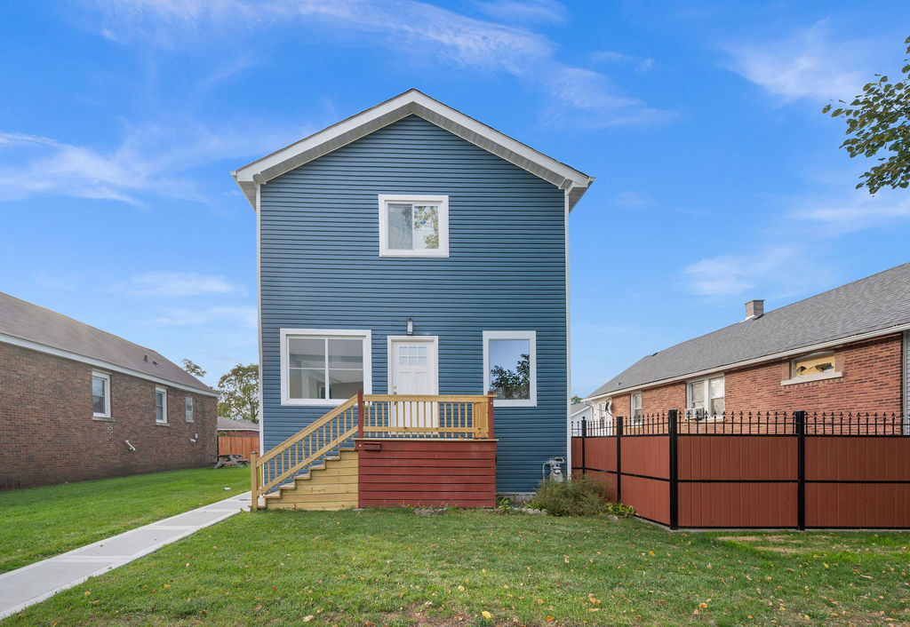 13518 South Ave K Chicago, IL 60633 - Photo 5 of 24 a front view of a house with a yard