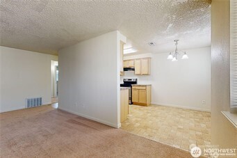 1928 J Street, Unit 205 Walla Walla, WA 99362 - Photo 18 of 20 a view of kitchen with refrigerator and window