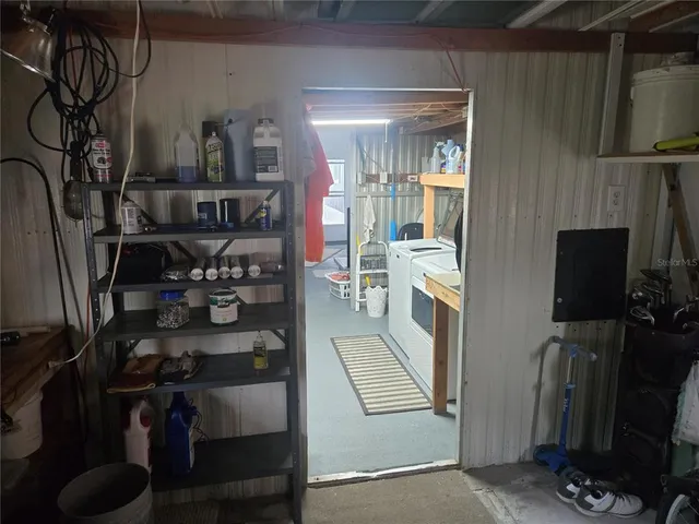 a view of a livingroom with furniture and a flat screen tv