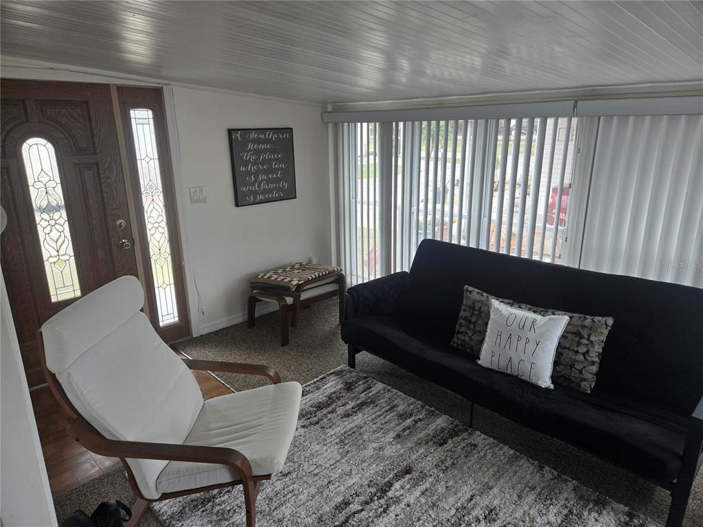 1710 7th Street Southwest, Unit 93 Ruskin, FL 33570 - Photo 19 of 38 a living room with furniture and a window