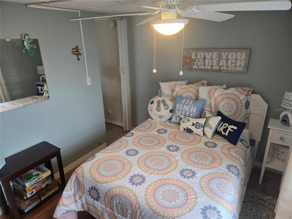 1710 7th Street Southwest, Unit 93 Ruskin, FL 33570 - Photo 22 of 38 a bedroom with a bed and a window