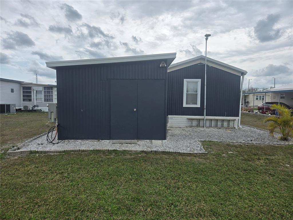 1710 7th Street Southwest, Unit 93 Ruskin, FL 33570 - Photo 33 of 38 a front view of a house with garden
