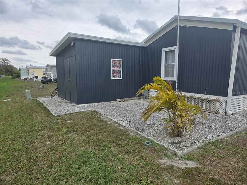 1710 7th Street Southwest, Unit 93 Ruskin, FL 33570 - Photo 34 of 38 a view of backyard of the house