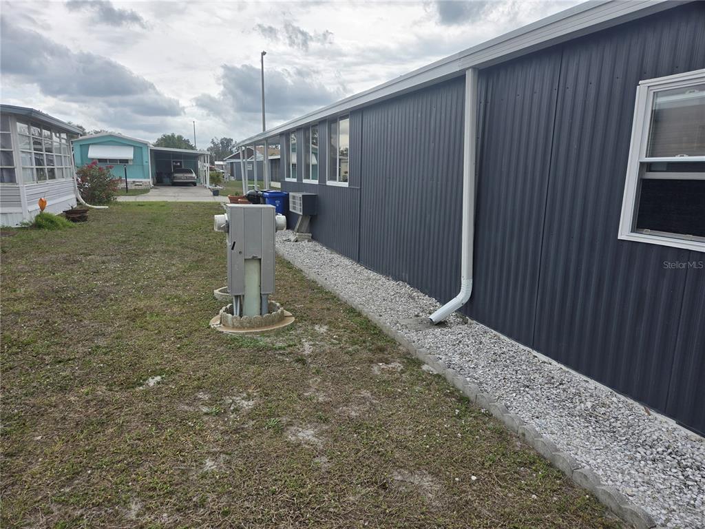 1710 7th Street Southwest, Unit 93 Ruskin, FL 33570 - Photo 36 of 38 a view of a house with a outdoor space
