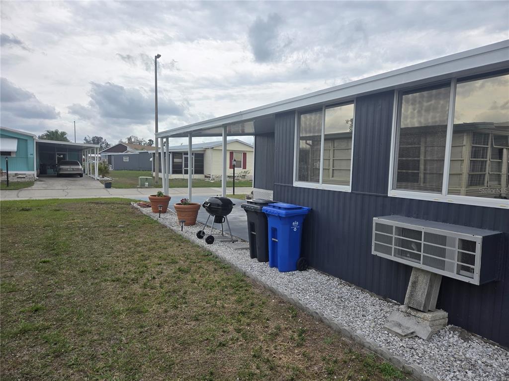 1710 7th Street Southwest, Unit 93 Ruskin, FL 33570 - Photo 37 of 38 a view of a house with a bath tub and chairs