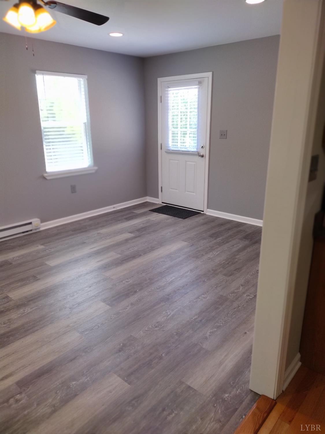 4499 Stage Road Concord, VA 24538 - Photo 14 of 64 an empty room with wooden floor and windows