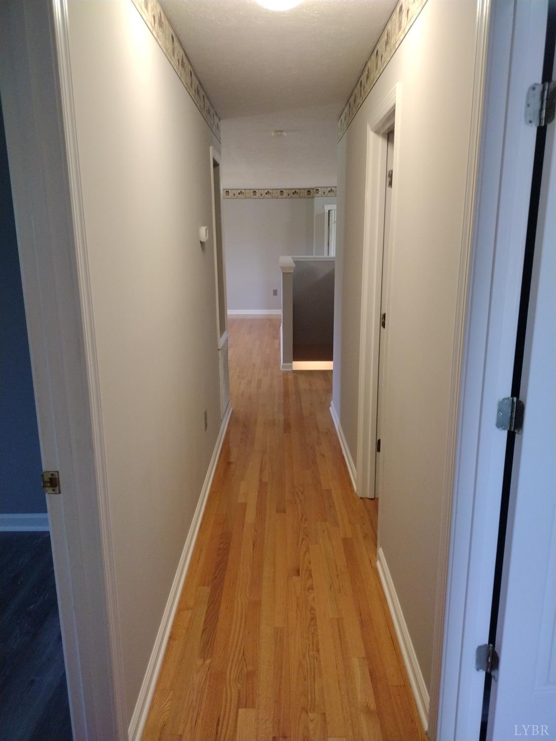 4499 Stage Road Concord, VA 24538 - Photo 33 of 64 a view of a hallway with wooden floor and staircase