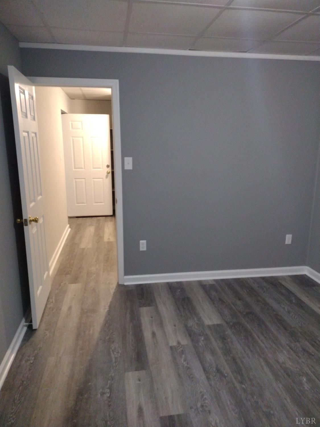 4499 Stage Road Concord, VA 24538 - Photo 43 of 64 an empty room with wooden floor and windows