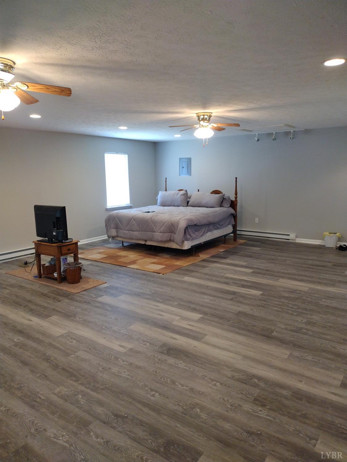 4499 Stage Road Concord, VA 24538 - Photo 46 of 64 a bedroom with a bed and a chair