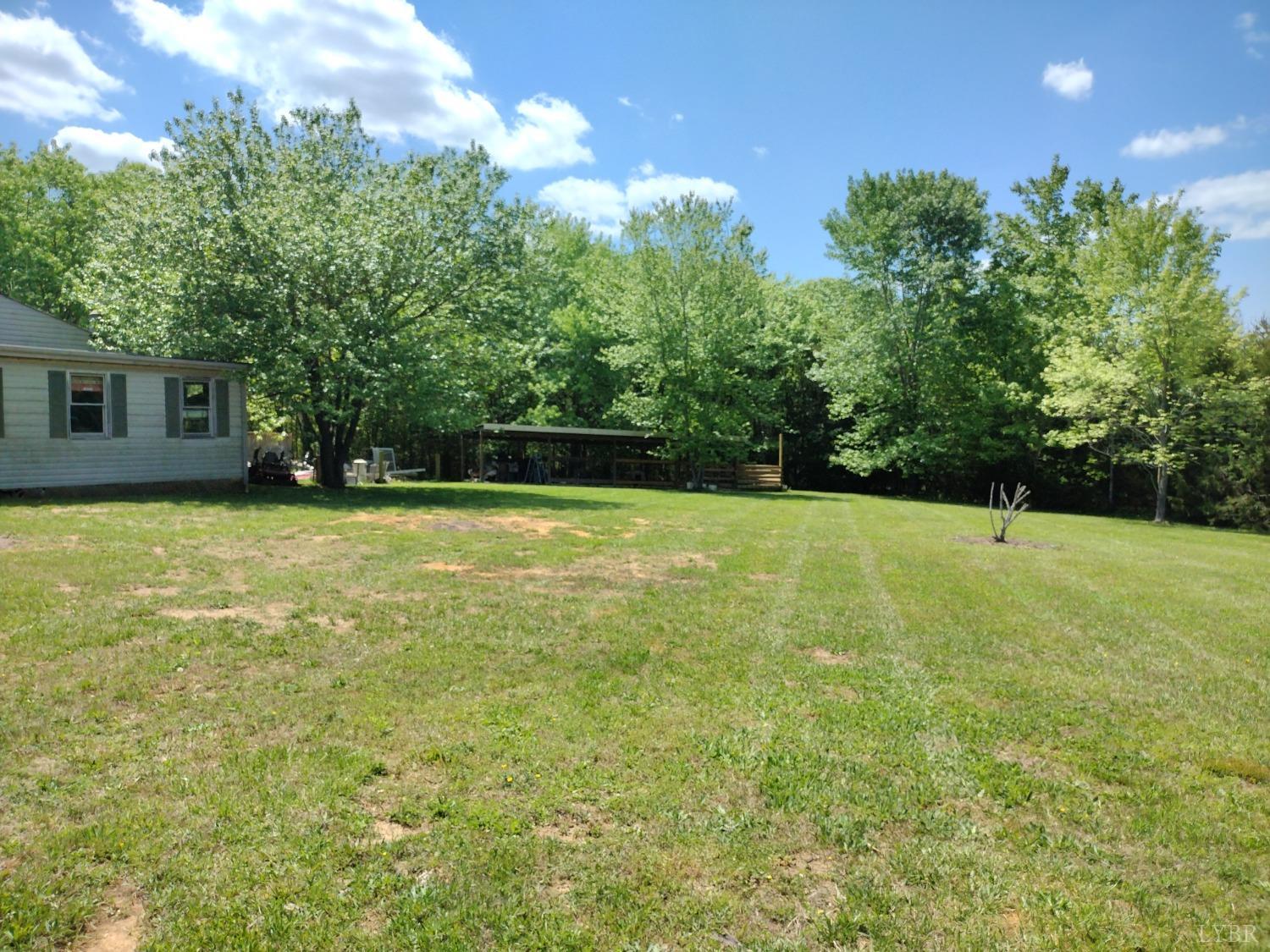 4499 Stage Road Concord, VA 24538 - Photo 49 of 64 a view of a garden with a house in the background