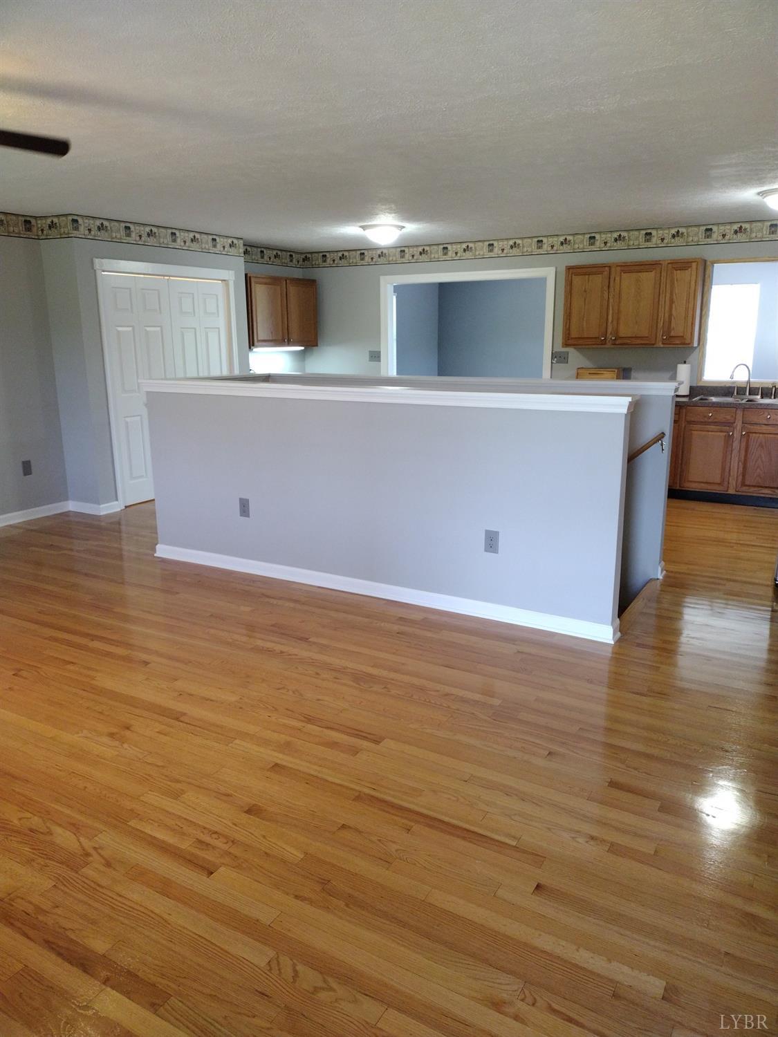 4499 Stage Road Concord, VA 24538 - Photo 7 of 64 a view of a kitchen with kitchen island wooden floors and stainless steel appliances