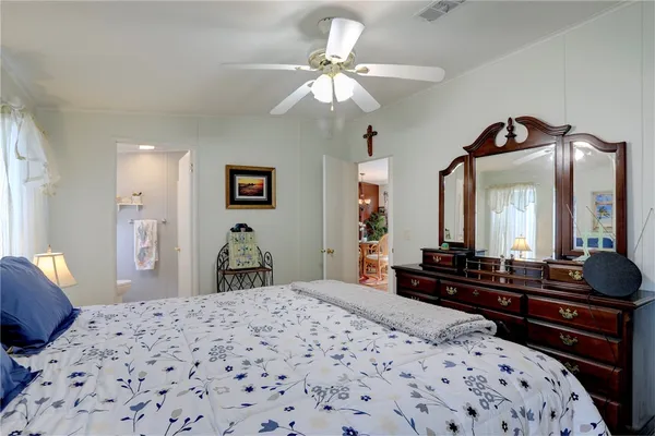 a bedroom with a bed and a dresser