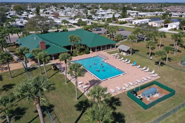 an aerial view of a house with a swimming pool