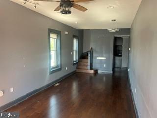 917 North Port Street Baltimore, MD 21205 - Photo 4 of 14 an empty room with wooden floor and windows