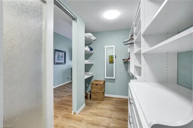 a bathroom with a tub a double vanity sink and mirror