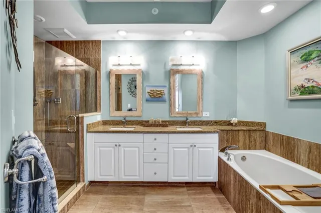 a bathroom with a granite countertop sink mirror and double