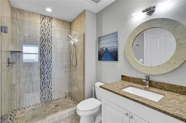 a living room with furniture fireplace and a window