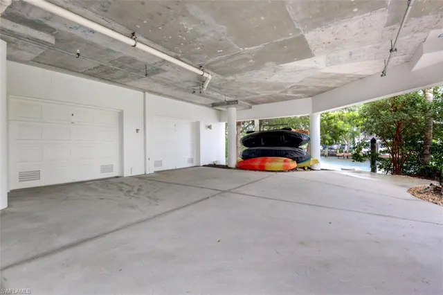 a street sign on a sidewalk next to a road