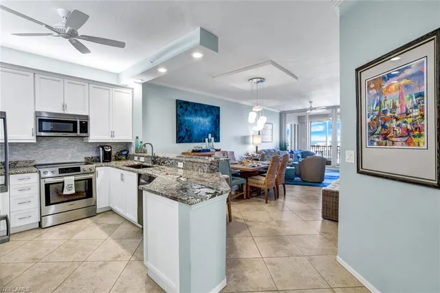 a kitchen with counter top space appliances and cabinets