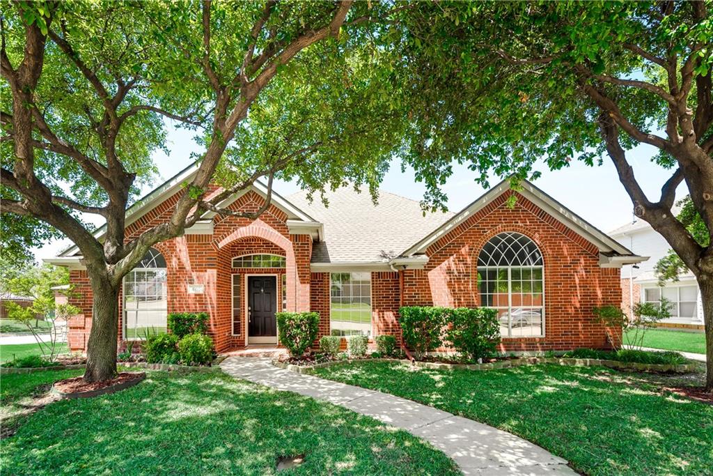 401 Ridge Point Drive Lewisville, TX 75067 - Photo 1 of 1 a front view of a house with yard and green space