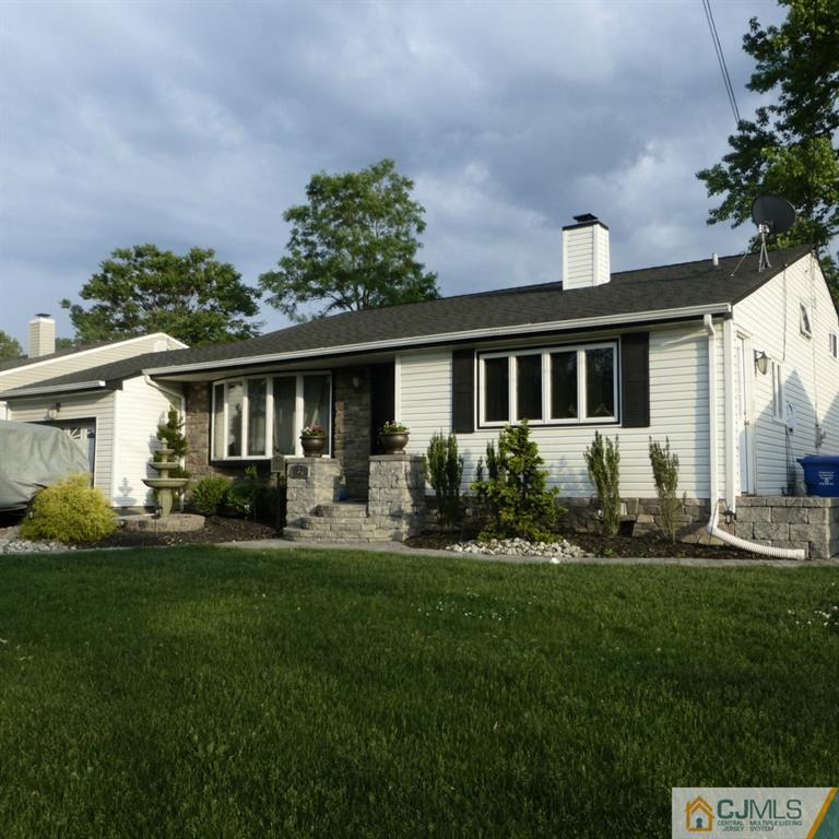 37 Albemarle Road Colonia, NJ 07067 - Photo 8 of 8 a front view of a house with a yard and trees