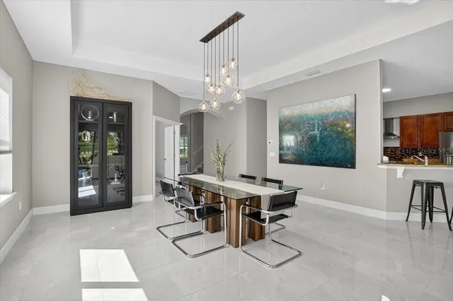a view of a dining room with furniture and window