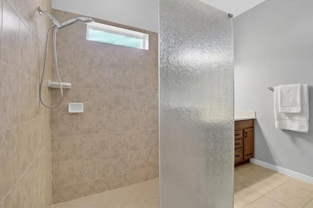 a bed room with a bed and a bookshelf