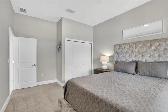a view of a house with backyard porch and sitting area