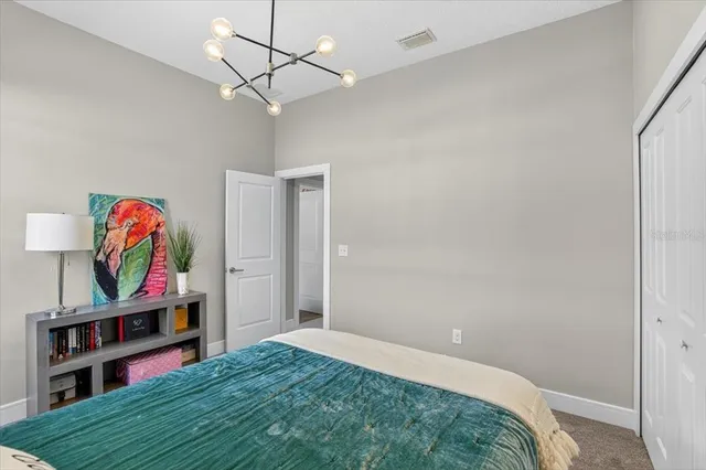 a view of a patio with a table chairs and a lake view
