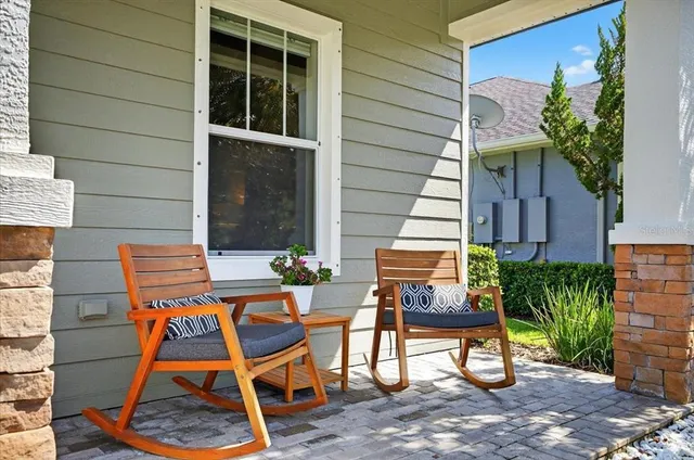 a living room with furniture and a view of kitchen