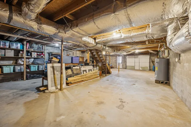 a view of a garage with wooden shelves