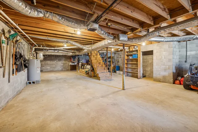 a view of empty room with wooden ceiling