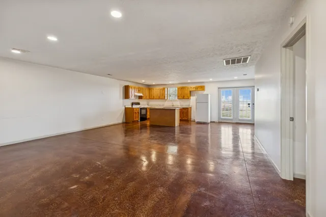a view of work space with wooden floor and furniture