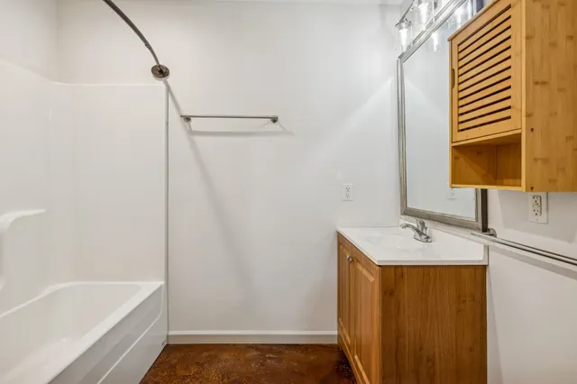 a bathroom with a sink and a bathtub